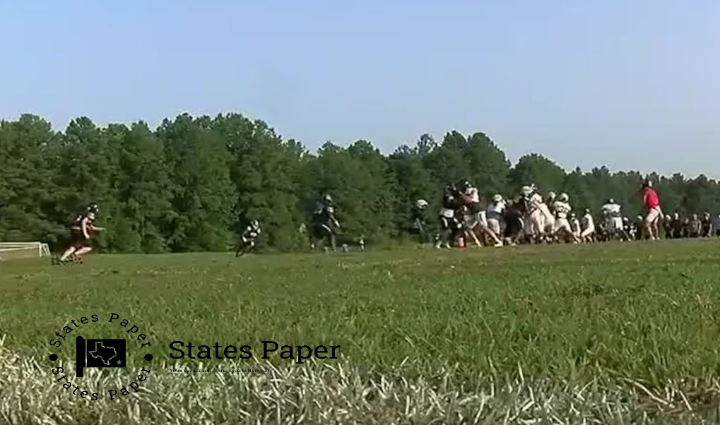 High school football team power through humid practice in early morning heat